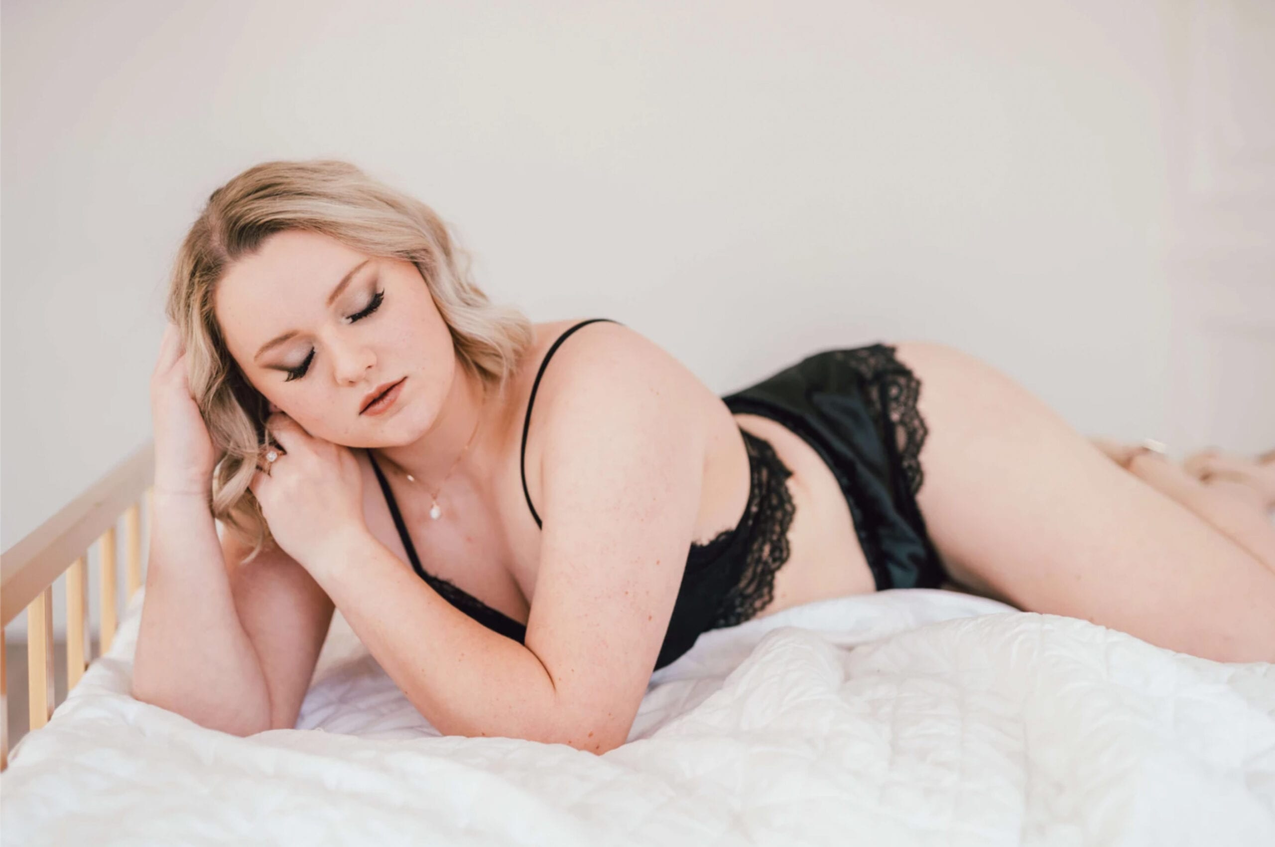 love brittny boudoir laying on bed